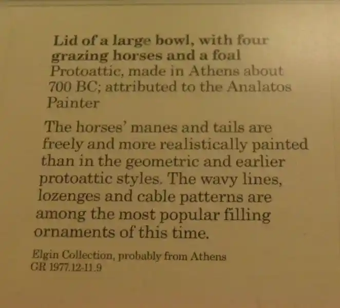 Lid of a large bowl with a solar disc design and a cross on top